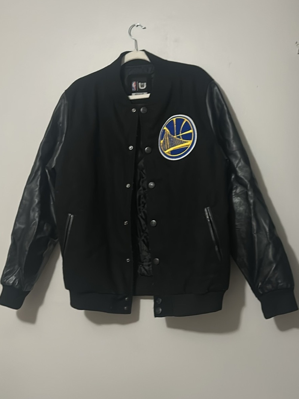 A Golden State Warriors full-snap varsity jacket